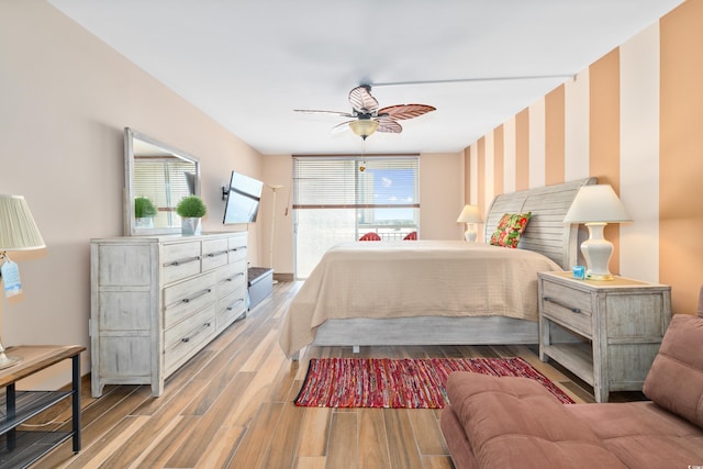 9820 Queensway Blvd Unit 502, Myrtle Beach, SC 29572 - bedroom featuring wallpapered walls, wood finished floors, and ceiling fan