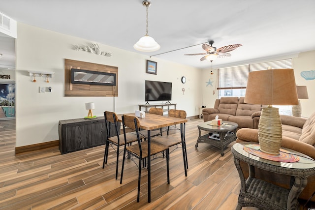 9820 Queensway Blvd Unit 502, Myrtle Beach, SC 29572 - living room with wood finished floors, a ceiling fan, and baseboards