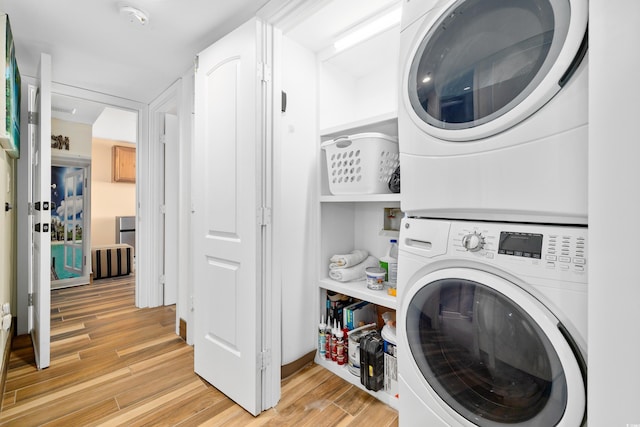 9820 Queensway Blvd Unit 502, Myrtle Beach, SC 29572 - laundry area with stacked washer and clothes dryer and light wood-style flooring