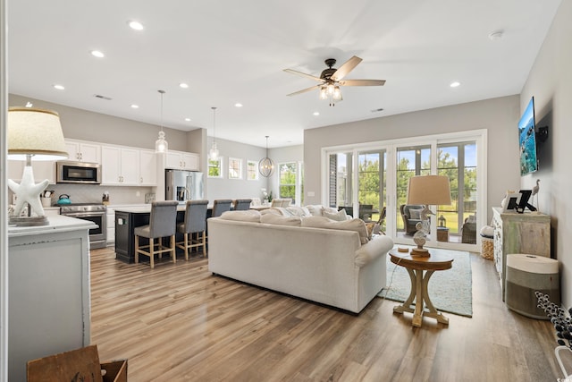 314 Bumble Cir, Murrells Inlet, SC 29576 - living room with light wood-style flooring, ceiling fan, and recessed lighting