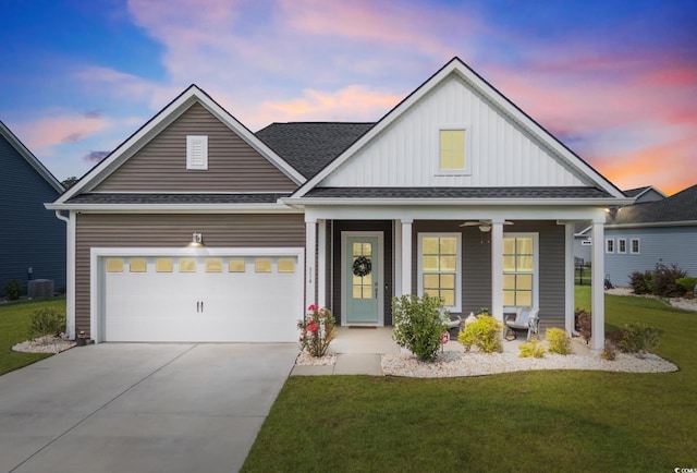 314 Bumble Cir, Murrells Inlet, SC 29576 - view of front of property featuring a front yard, board and batten siding, a porch, driveway, and an attached garage