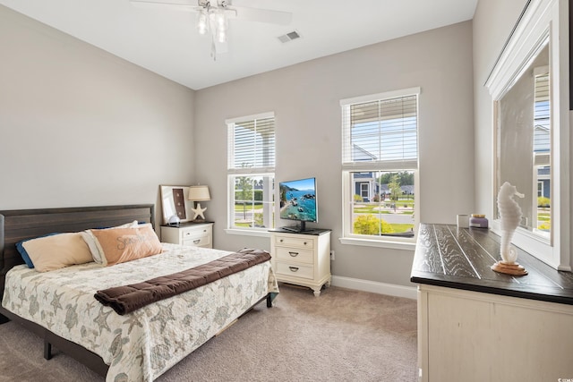 314 Bumble Cir, Murrells Inlet, SC 29576 - bedroom featuring light colored carpet, multiple windows, and ceiling fan