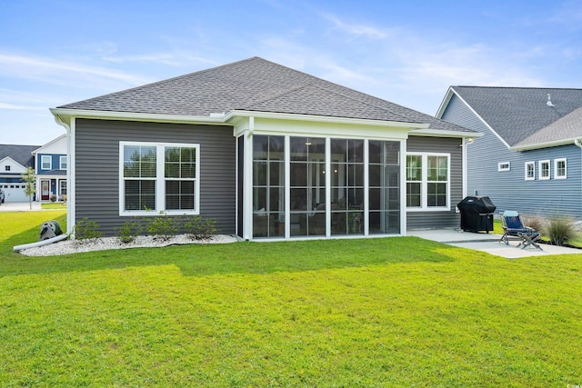 314 Bumble Cir, Murrells Inlet, SC 29576 - rear view of house with a patio, a sunroom, a lawn, and roof with shingles