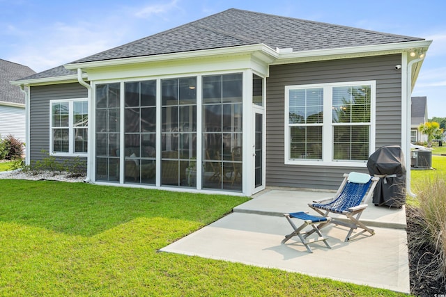 314 Bumble Cir, Murrells Inlet, SC 29576 - back of house featuring a patio area, a sunroom, a yard, and roof with shingles