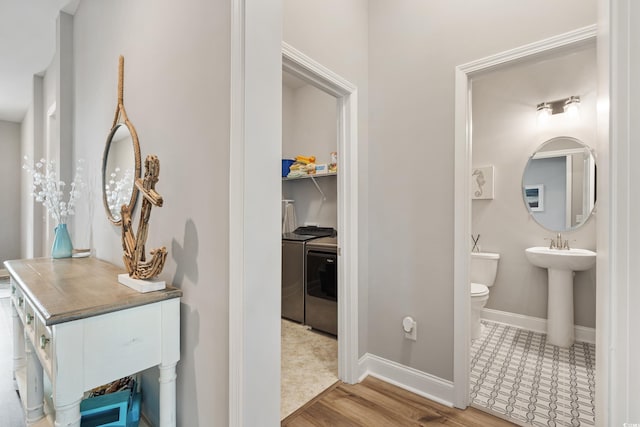 314 Bumble Cir, Murrells Inlet, SC 29576 - bathroom with separate washer and dryer and wood finished floors