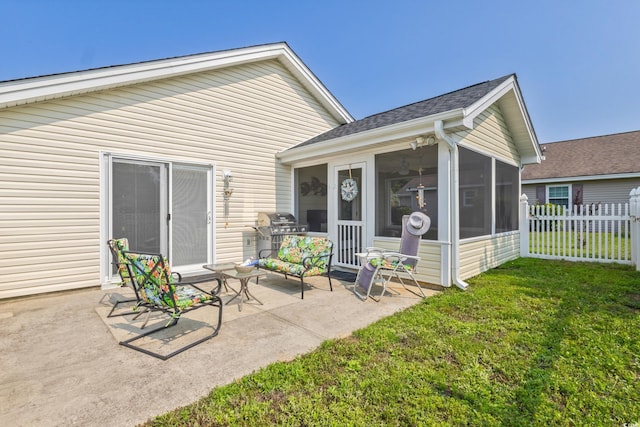 1407 Sunningdale Ln, Myrtle Beach, SC 29588 - rear view of property featuring a sunroom, a patio, and roof with shingles