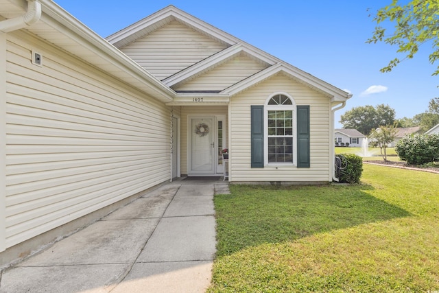 1407 Sunningdale Ln, Myrtle Beach, SC 29588 - view of exterior entry featuring a yard