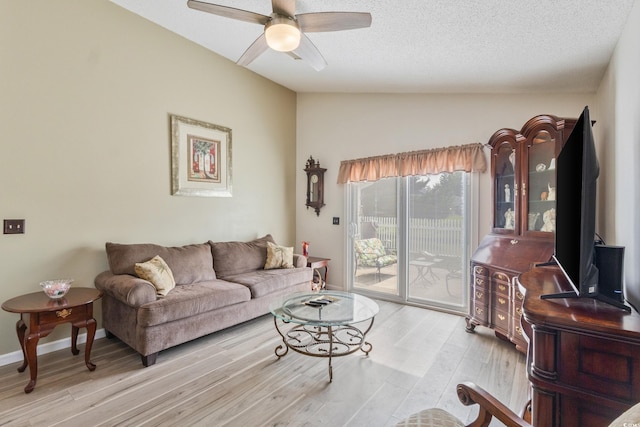 1407 Sunningdale Ln, Myrtle Beach, SC 29588 - living area with ceiling fan, light wood-type flooring, vaulted ceiling, and a textured ceiling