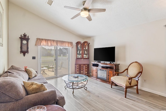 1407 Sunningdale Ln, Myrtle Beach, SC 29588 - living room with a ceiling fan, lofted ceiling, a textured ceiling, and light wood-type flooring