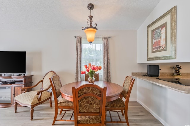 1407 Sunningdale Ln, Myrtle Beach, SC 29588 - dining space with a textured ceiling and light wood-type flooring