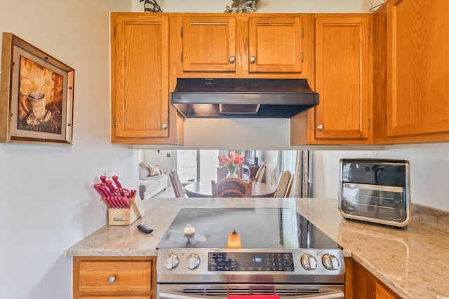 1407 Sunningdale Ln, Myrtle Beach, SC 29588 - kitchen featuring stainless steel range with electric stovetop, under cabinet range hood, brown cabinetry, and light stone countertops