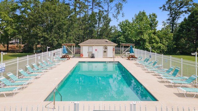 1407 Sunningdale Ln, Myrtle Beach, SC 29588 - community pool with view of scattered trees and a patio