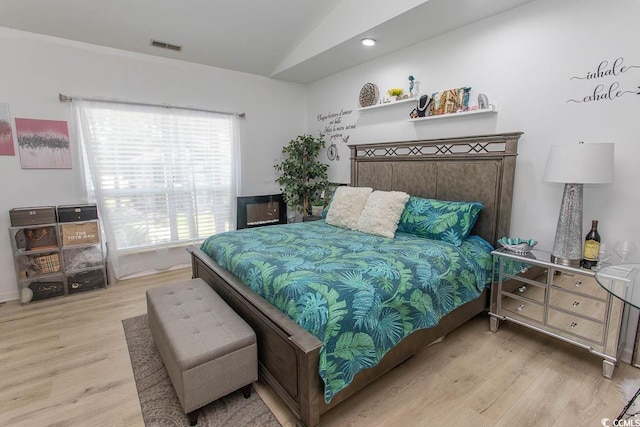 108 Pipers Ln Unit 108, Myrtle Beach, SC 29575 - bedroom featuring wood finished floors and vaulted ceiling