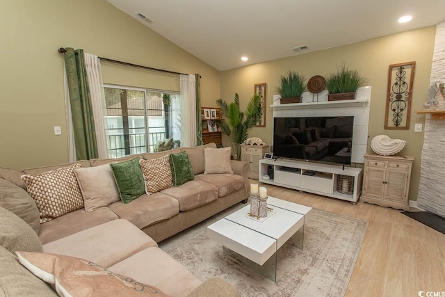 108 Pipers Ln Unit 108, Myrtle Beach, SC 29575 - living room with wood finished floors, lofted ceiling, a fireplace, and recessed lighting