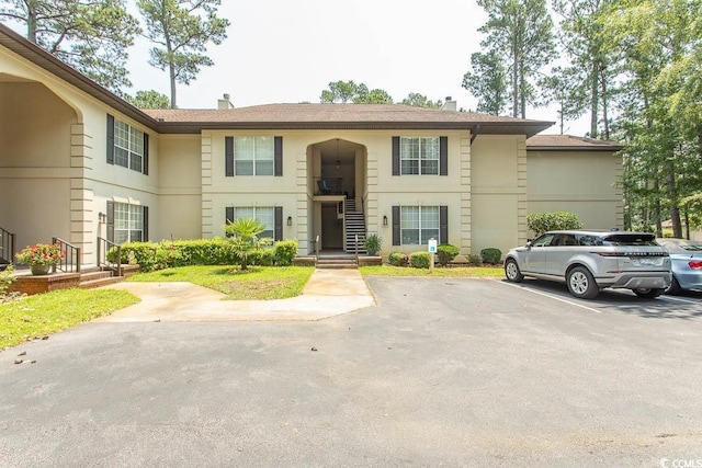 108 Pipers Ln Unit 108, Myrtle Beach, SC 29575 - townhome / multi-family property featuring uncovered parking and a chimney