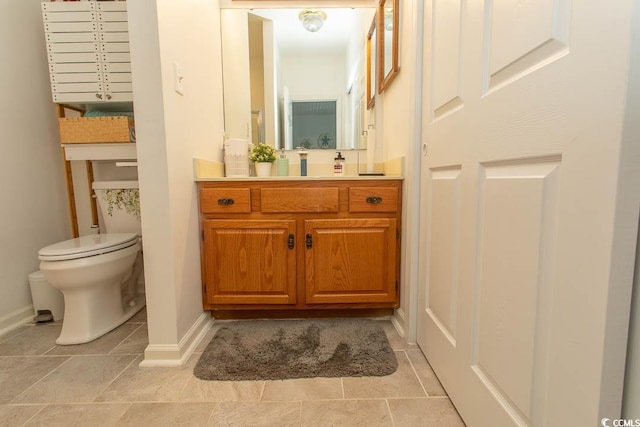 108 Pipers Ln Unit 108, Myrtle Beach, SC 29575 - bathroom with vanity, toilet, baseboards, and tile patterned floors