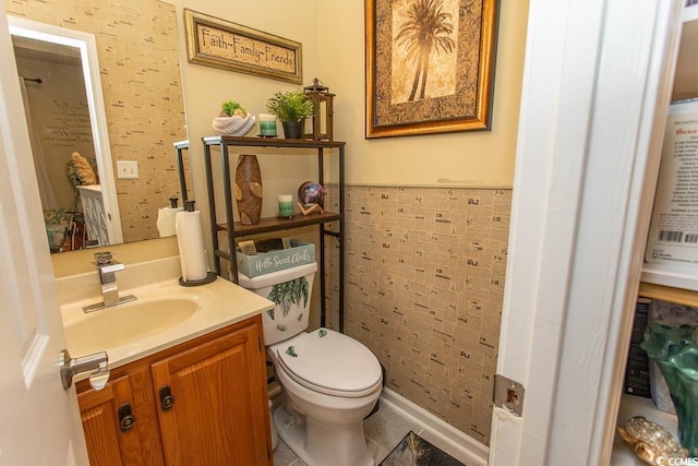 108 Pipers Ln Unit 108, Myrtle Beach, SC 29575 - half bathroom featuring vanity, toilet, a wainscoted wall, and tile patterned floors