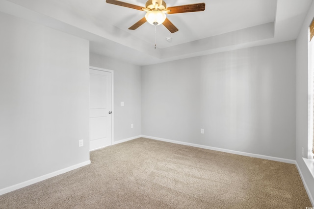 3547 Ladybank Loop, Myrtle Beach, SC 29577 - spare room featuring a raised ceiling, ceiling fan, carpet floors, and baseboards