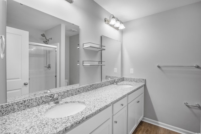 3547 Ladybank Loop, Myrtle Beach, SC 29577 - full bathroom featuring a shower stall, double vanity, toilet, wood finished floors, and baseboards