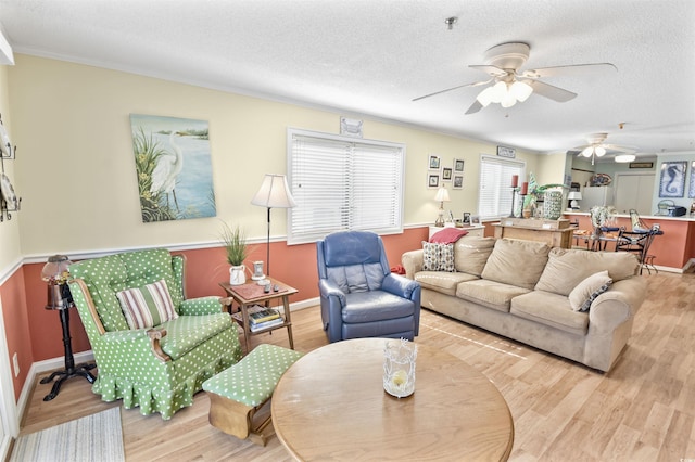 4350 Intercoastal Dr Unit 1101, Little River, SC 29566 - living area with ceiling fan, wood finished floors, a textured ceiling, and ornamental molding