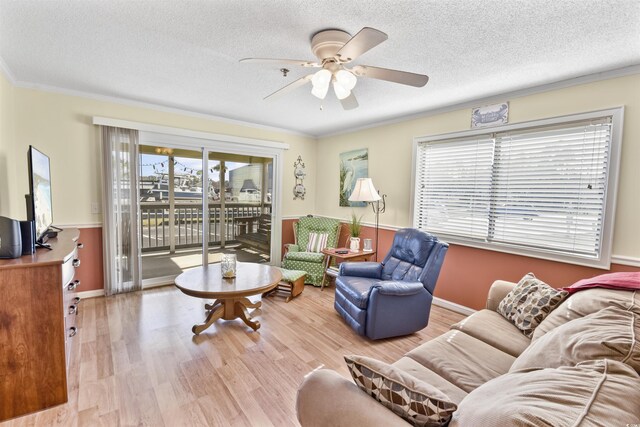 4350 Intercoastal Dr Unit 1101, Little River, SC 29566 - living room with ceiling fan, ornamental molding, wood finished floors, a textured ceiling, and baseboards