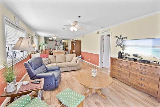 4350 Intercoastal Dr Unit 1101, Little River, SC 29566 - living area with light wood-style floors, a ceiling fan, a textured ceiling, crown molding, and baseboards