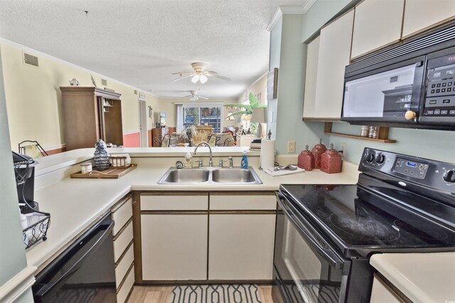 4350 Intercoastal Dr Unit 1101, Little River, SC 29566 - kitchen featuring black appliances, a sink, light countertops, a ceiling fan, and crown molding