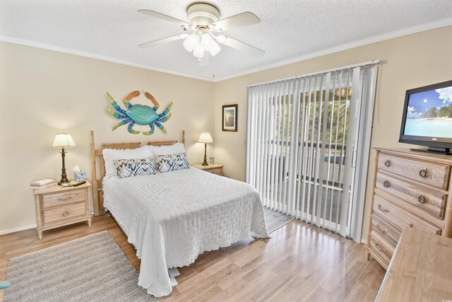 4350 Intercoastal Dr Unit 1101, Little River, SC 29566 - bedroom featuring access to outside, light wood-type flooring, crown molding, a textured ceiling, and ceiling fan