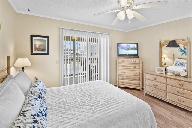 4350 Intercoastal Dr Unit 1101, Little River, SC 29566 - bedroom featuring wood finished floors, crown molding, access to outside, a textured ceiling, and ceiling fan