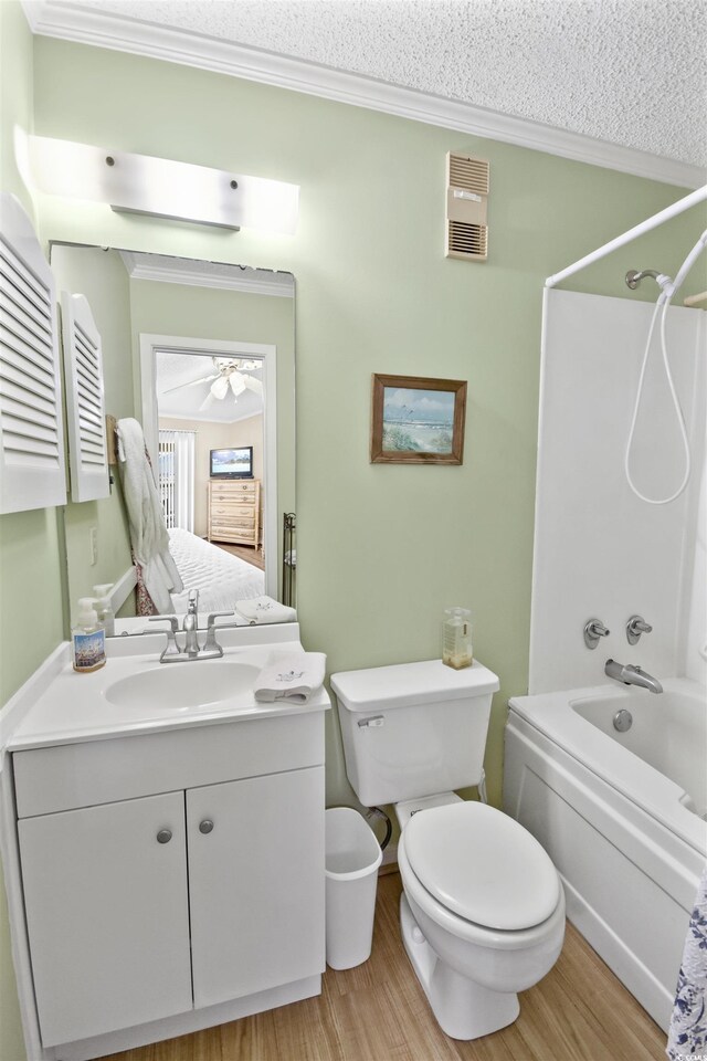 4350 Intercoastal Dr Unit 1101, Little River, SC 29566 - full bathroom featuring crown molding, bathing tub / shower combination, vanity, wood finished floors, and toilet