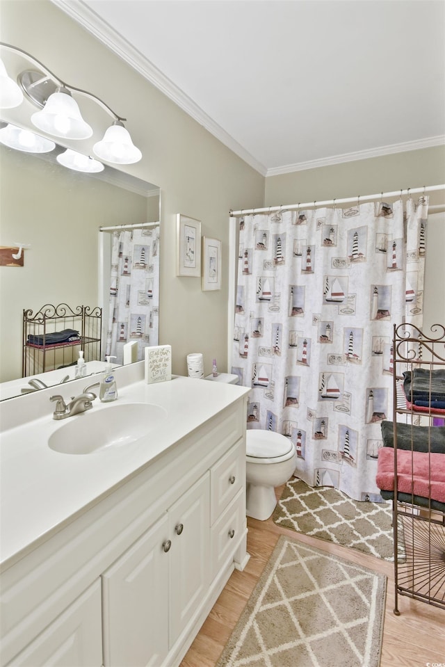 4350 Intercoastal Dr Unit 1101, Little River, SC 29566 - full bathroom featuring vanity, toilet, ornamental molding, wood finished floors, and a shower with shower curtain