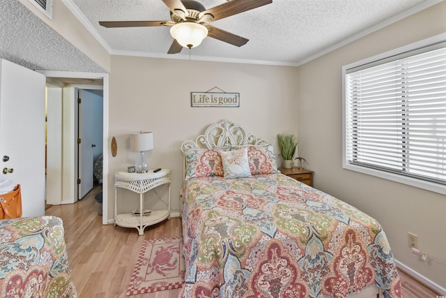 4350 Intercoastal Dr Unit 1101, Little River, SC 29566 - bedroom with wood finished floors, ornamental molding, a textured ceiling, and a ceiling fan