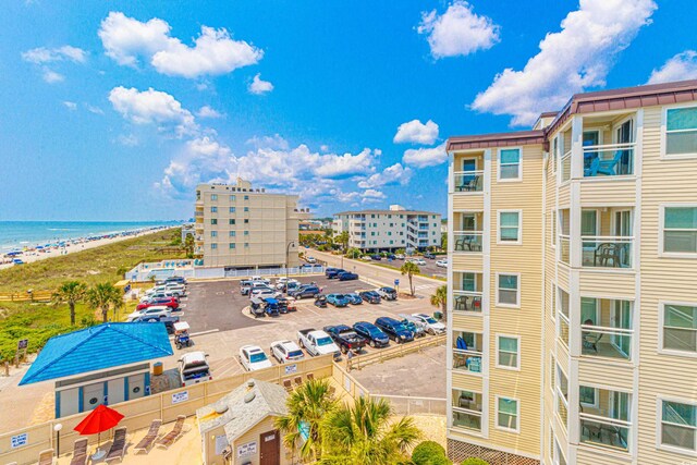 4525 S Ocean Blvd Unit 406, North Myrtle Beach, SC 29582 - view of property featuring uncovered parking and a water view