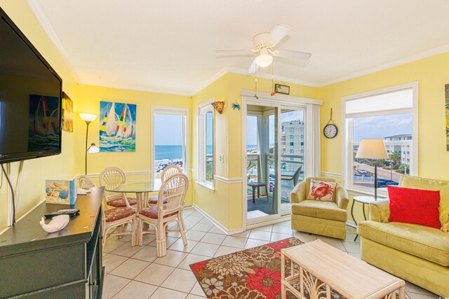 4525 S Ocean Blvd Unit 406, North Myrtle Beach, SC 29582 - living area with light tile patterned floors, ceiling fan, crown molding, and baseboards