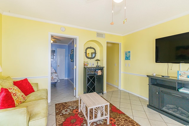 4525 S Ocean Blvd Unit 406, North Myrtle Beach, SC 29582 - living area featuring light tile patterned floors, ornamental molding, a ceiling fan, arched walkways, and baseboards