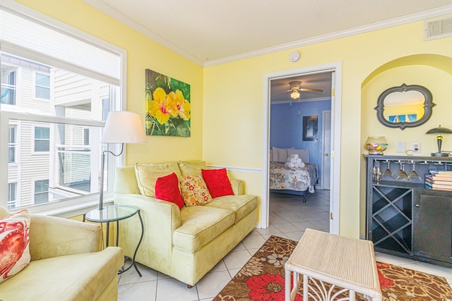 4525 S Ocean Blvd Unit 406, North Myrtle Beach, SC 29582 - living room featuring ornamental molding, tile patterned flooring, healthy amount of natural light, and ceiling fan