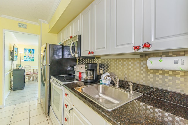 4525 S Ocean Blvd Unit 406, North Myrtle Beach, SC 29582 - kitchen featuring white range with electric cooktop, ornamental molding, stainless steel microwave, a sink, and white cabinets