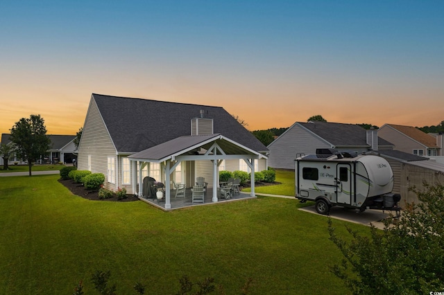 620 Seth Ln, Longs, SC 29568 - back of property with a gazebo, a yard, a patio, roof with shingles, and a chimney