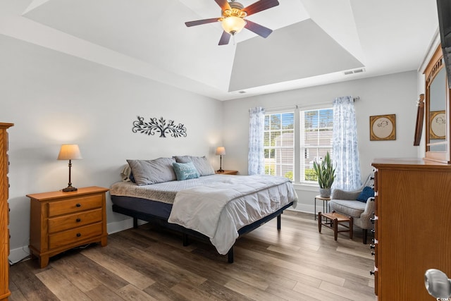 620 Seth Ln, Longs, SC 29568 - bedroom with wood finished floors, a raised ceiling, baseboards, and ceiling fan