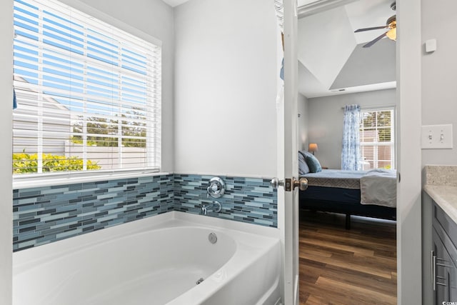620 Seth Ln, Longs, SC 29568 - ensuite bathroom featuring a garden tub, a ceiling fan, vanity, and wood finished floors