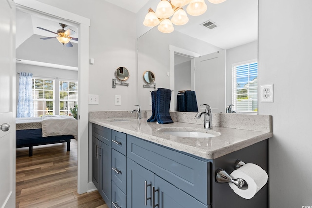 620 Seth Ln, Longs, SC 29568 - ensuite bathroom with double vanity, a chandelier, a ceiling fan, and wood finished floors