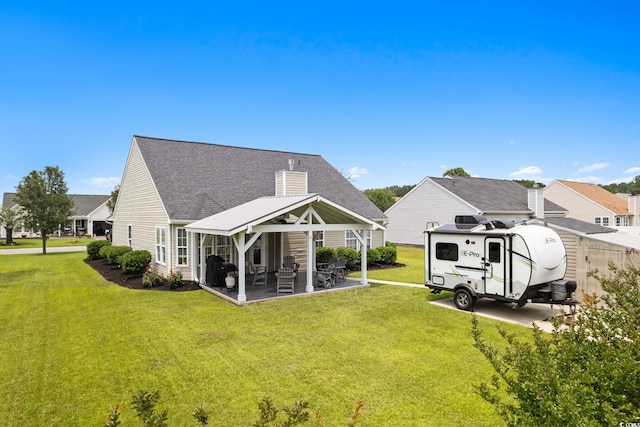 620 Seth Ln, Longs, SC 29568 - rear view of property with a yard, a patio, a shingled roof, a chimney, and a gazebo