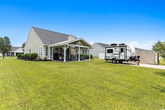 620 Seth Ln, Longs, SC 29568 - rear view of property with a lawn, a gazebo, a chimney, and a shingled roof