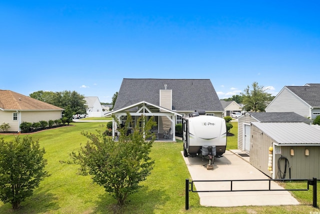 620 Seth Ln, Longs, SC 29568 - rear view of house with a lawn, a patio, a chimney, and a residential view