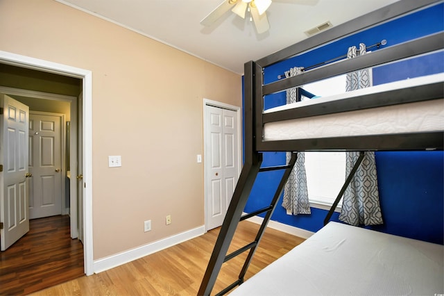 1412 Reid Ct, Myrtle Beach, SC 29588 - unfurnished bedroom with wood finished floors, baseboards, ornamental molding, a ceiling fan, and a closet