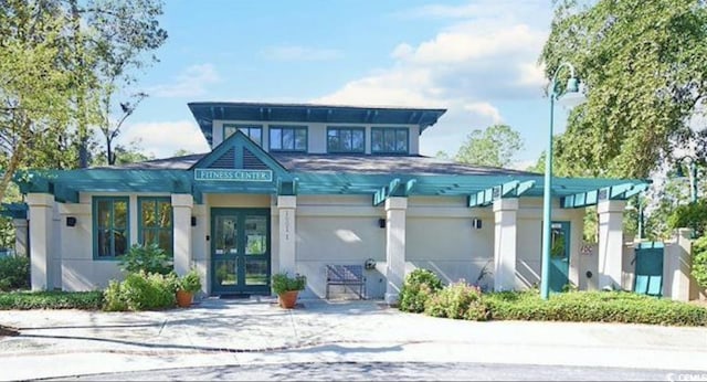 1221 Tidewater Dr Unit 122, North Myrtle Beach, SC 29582 - view of front of house featuring french doors and stucco siding
