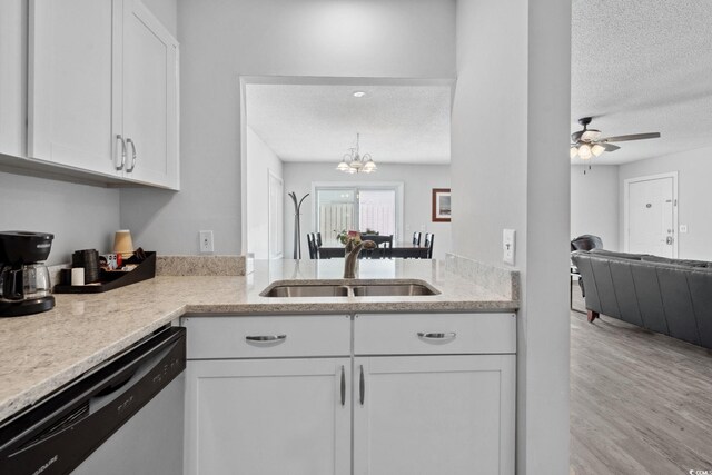 800 9th Ave S Unit E-4, North Myrtle Beach, SC 29582 - kitchen featuring a textured ceiling, dishwasher, white cabinets, wood finished floors, and a ceiling fan