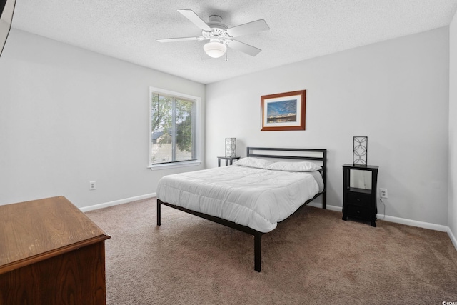800 9th Ave S Unit E-4, North Myrtle Beach, SC 29582 - carpeted bedroom featuring a textured ceiling and ceiling fan