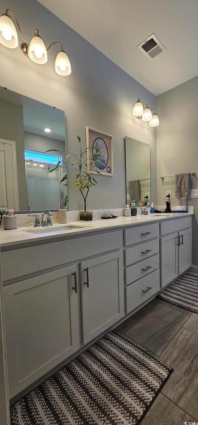 784 Flowering Branch Ave, Little River, SC 29566 - bathroom featuring double vanity and wood finished floors