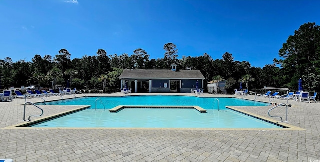 784 Flowering Branch Ave, Little River, SC 29566 - community pool with a patio and view of scattered trees
